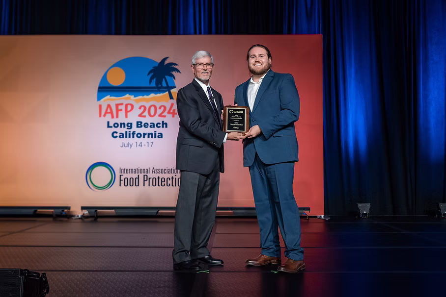Receiving the IAFP Student Travel Scholarship in 2024 in Long Beach, California